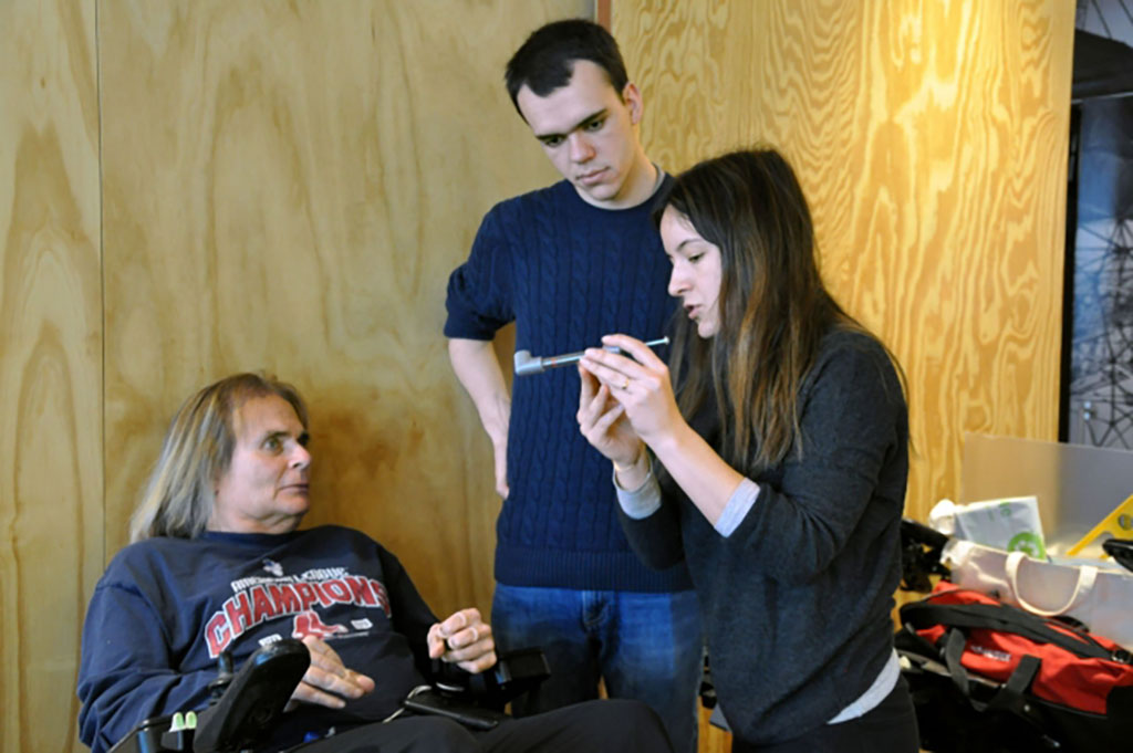 students helping a client with disabilities