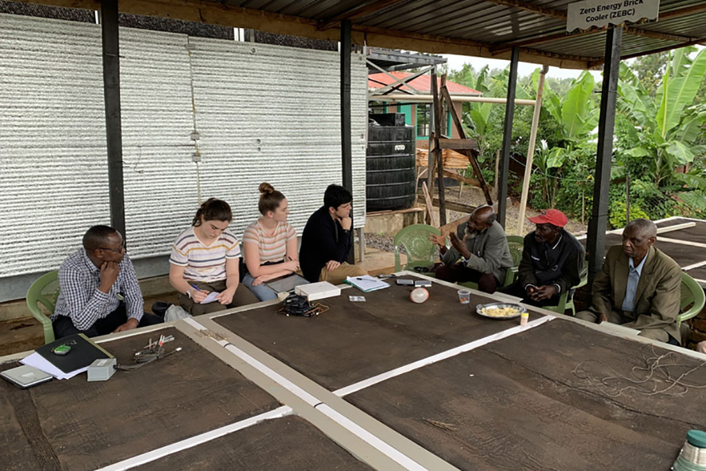 MIT students discussing evaporative cooling chambers with farming cooperatives members in Karurumo, Kenya.