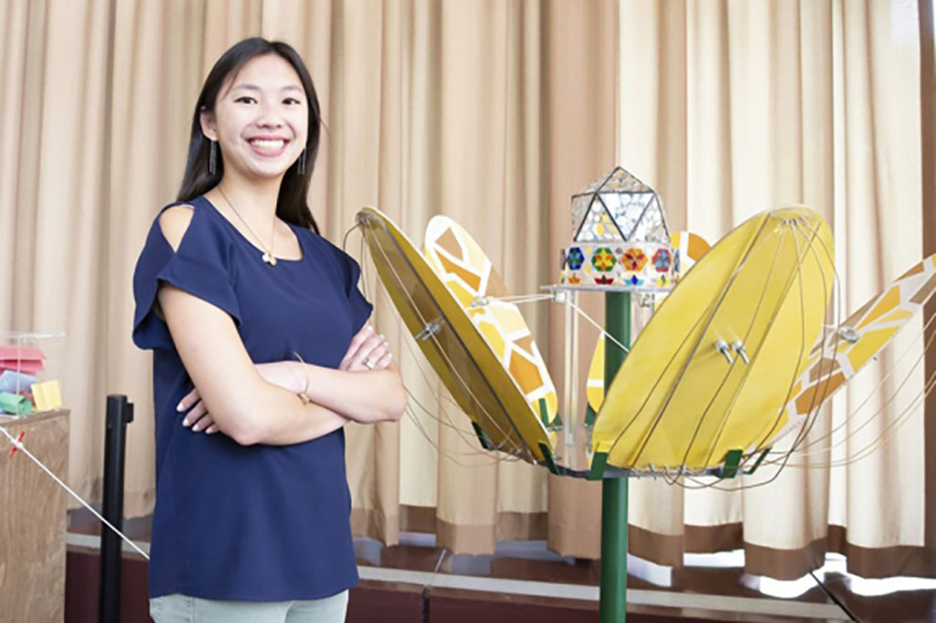 Stephanie Chou ’19 stands with her kinetic art sculpture
