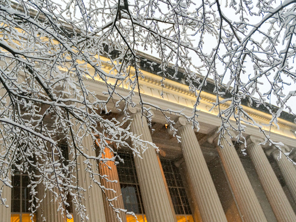 View of MIT Building 10 from Killian Court during snowy weather