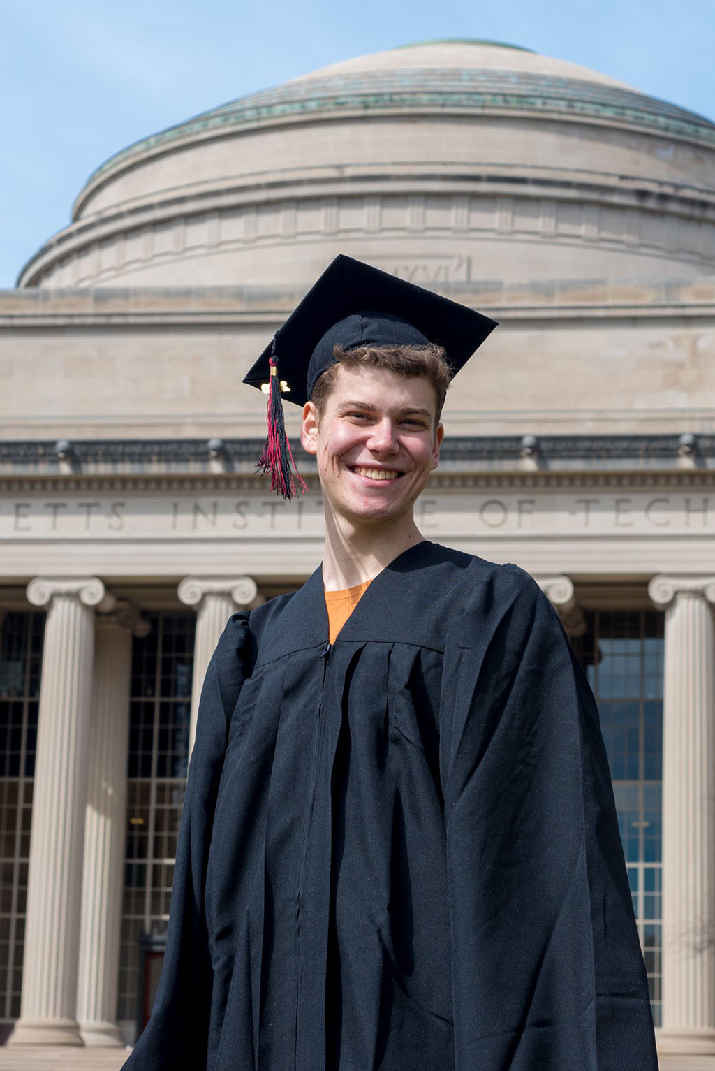 Portrait of Max Kessler in front of MIT dome