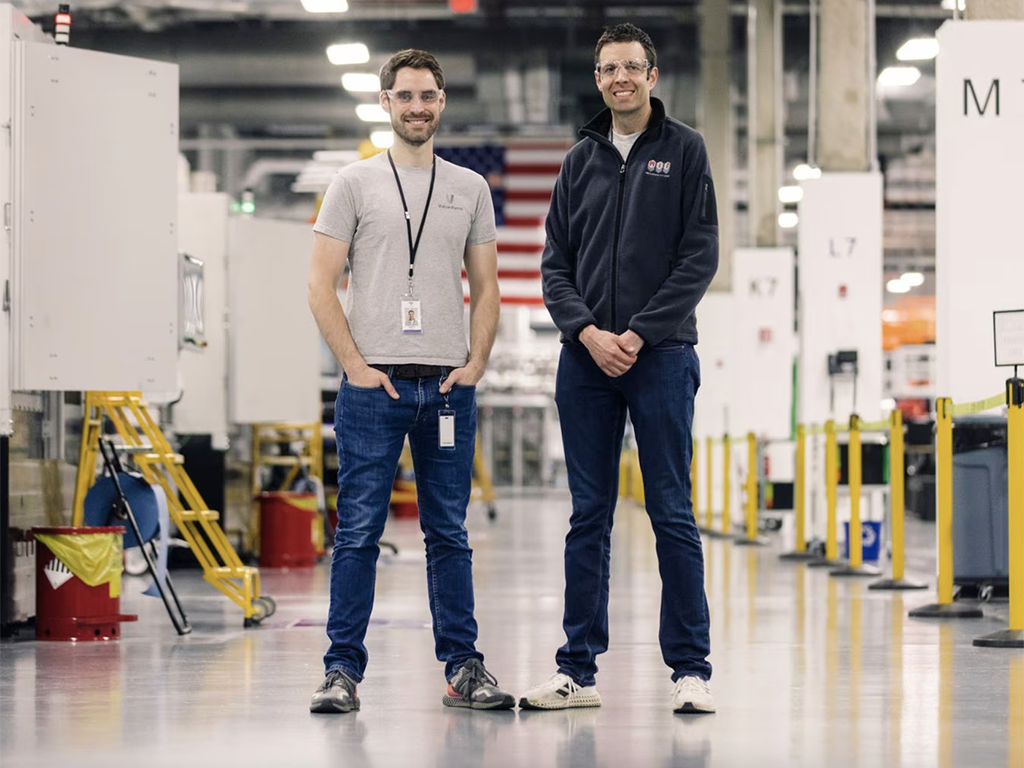Martin Feldmann and MIT professor John Hart in a factory operated by VulcanForms in Devens, Mass.