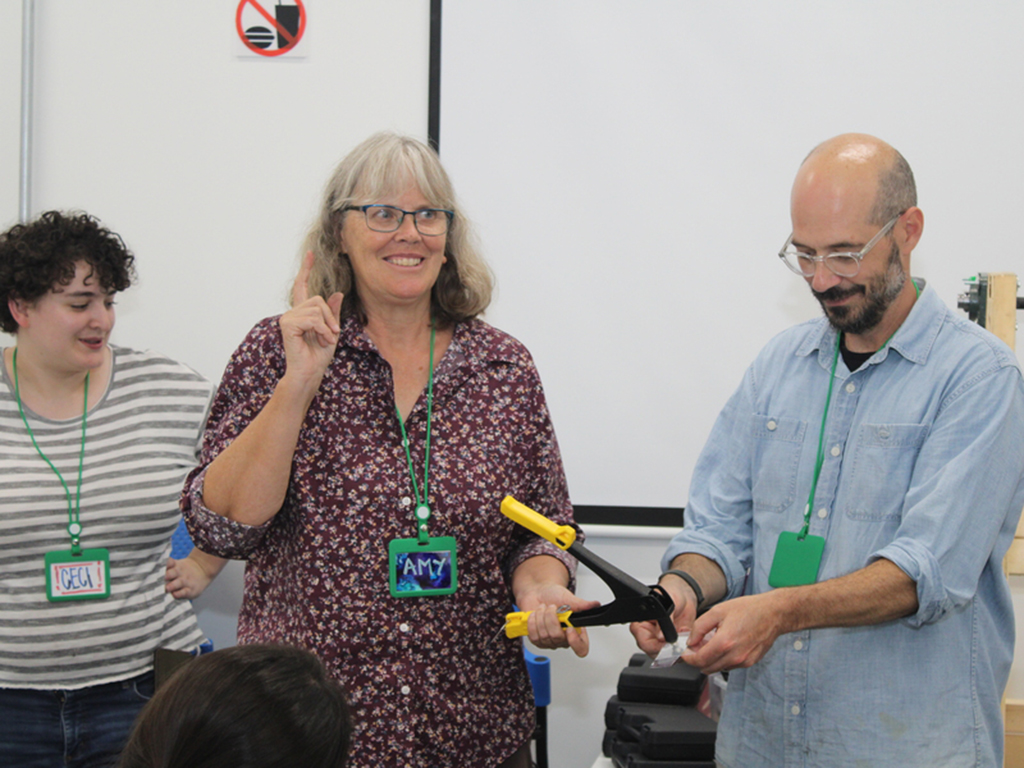  Three people in a Machine Elements and Advanced Design training.