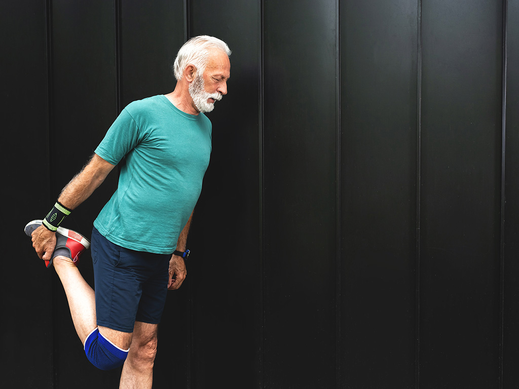A man balances on one leg