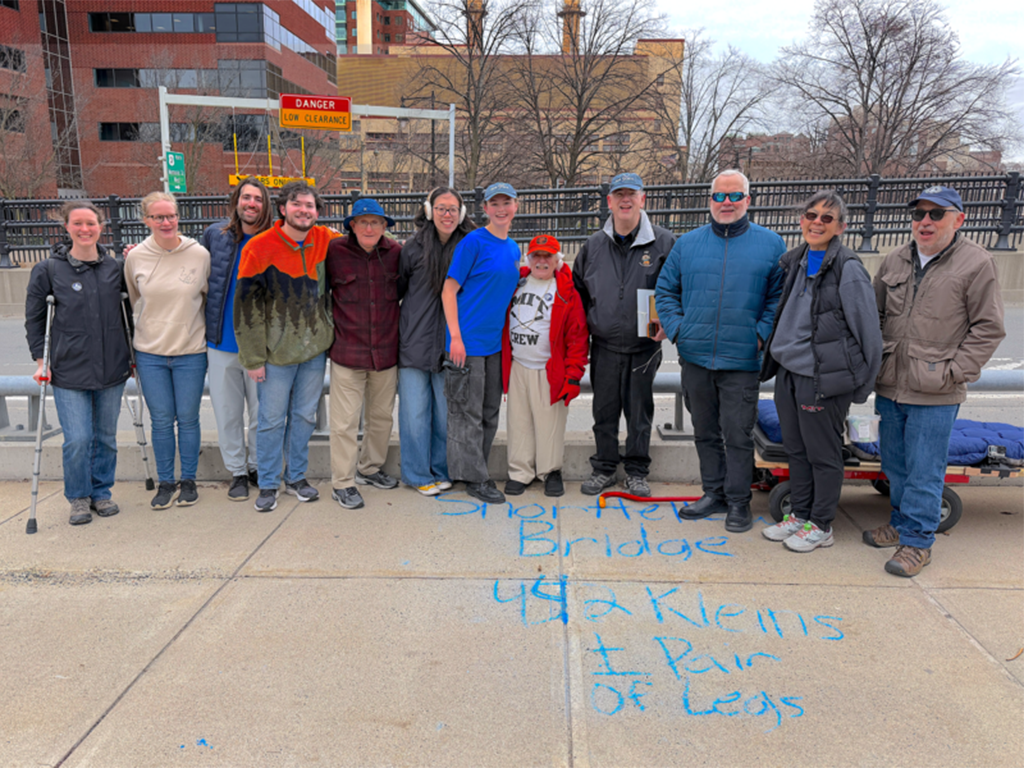 A group stands on the longfellow bridge in Boston