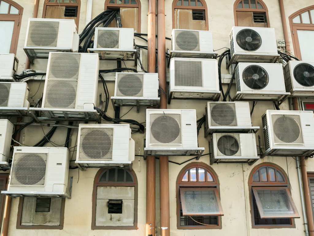 Air Conditioning Units pack most of the windows on a building shown