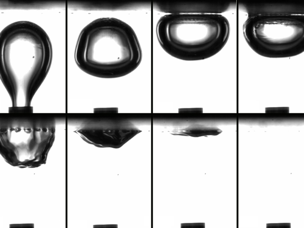 black and white photo, four panels, showing bubbles in stages of formation
