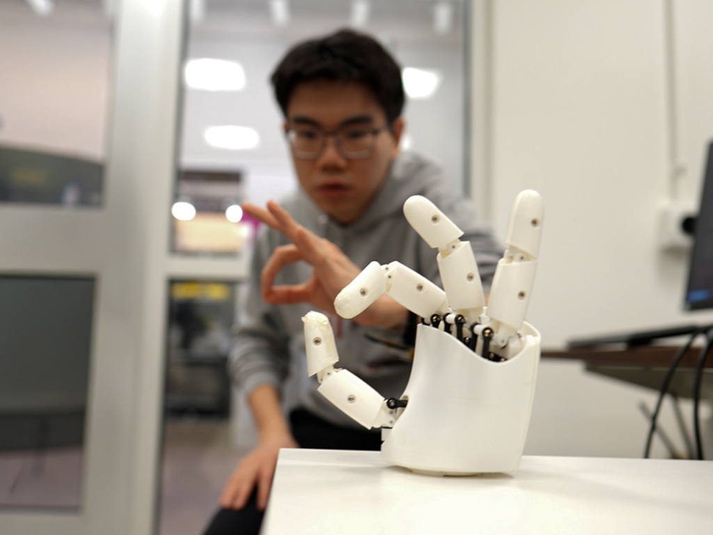 Wristband enables wearers to control a robotic hand with their own movements