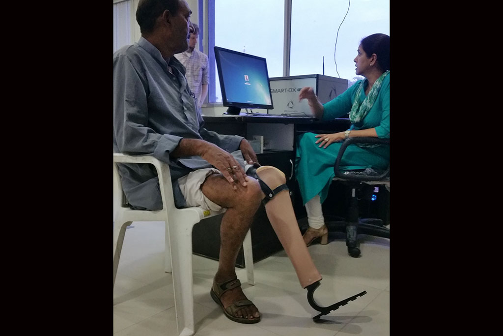 Indian gentleman getting a prosthetic