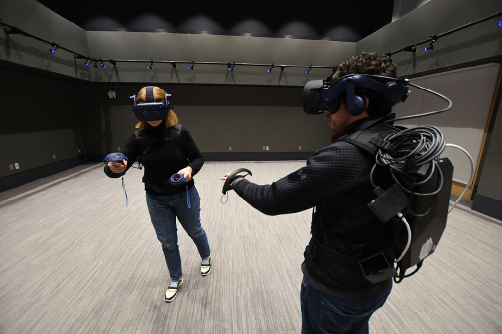 two MIT researches with VR headsets on