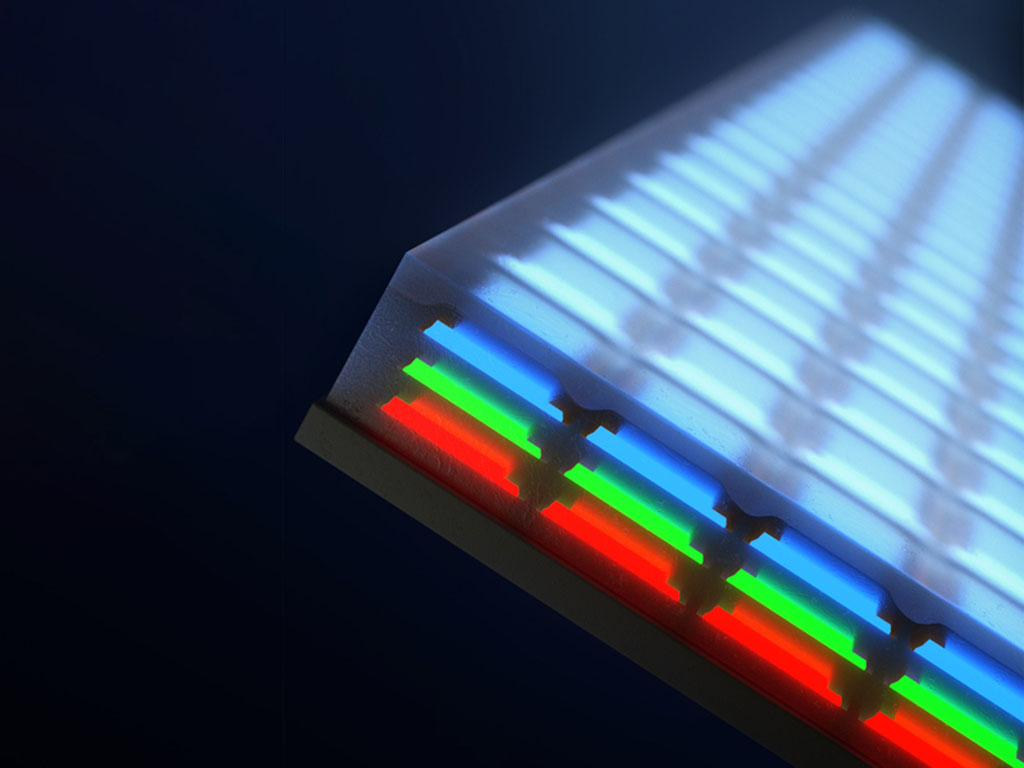 Closeup of a screen has 3 layers of individual LEDs; blue on top, then green and red.