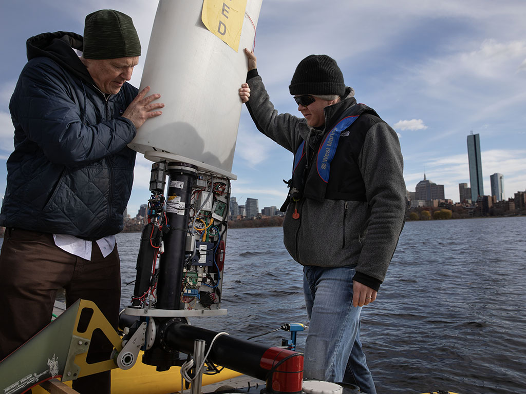 MIT researchers ready a marine vehicle for use in the Charles River