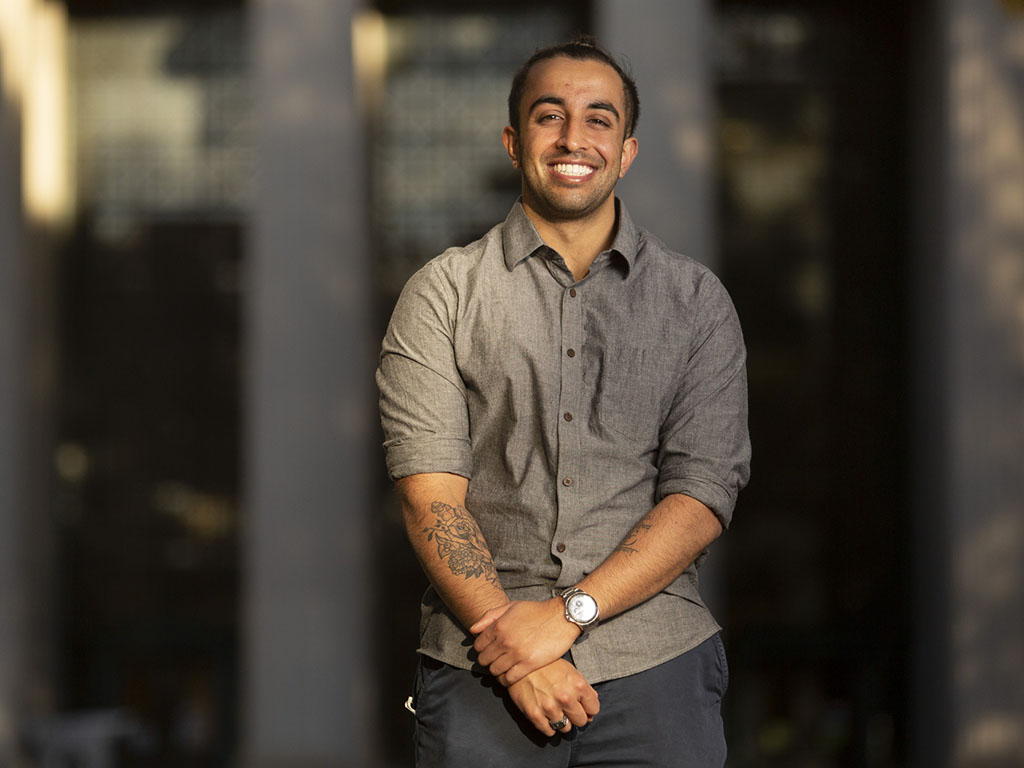 Portrait of mechanical engineering senior Arnav Patel outside Building 7 at MIT.