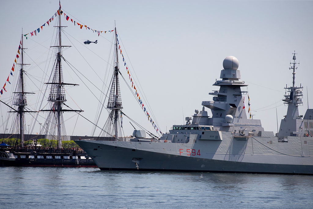 The Italian naval warship ITS Alpino (foreground) sails alongside the USS Constitution in Boston
