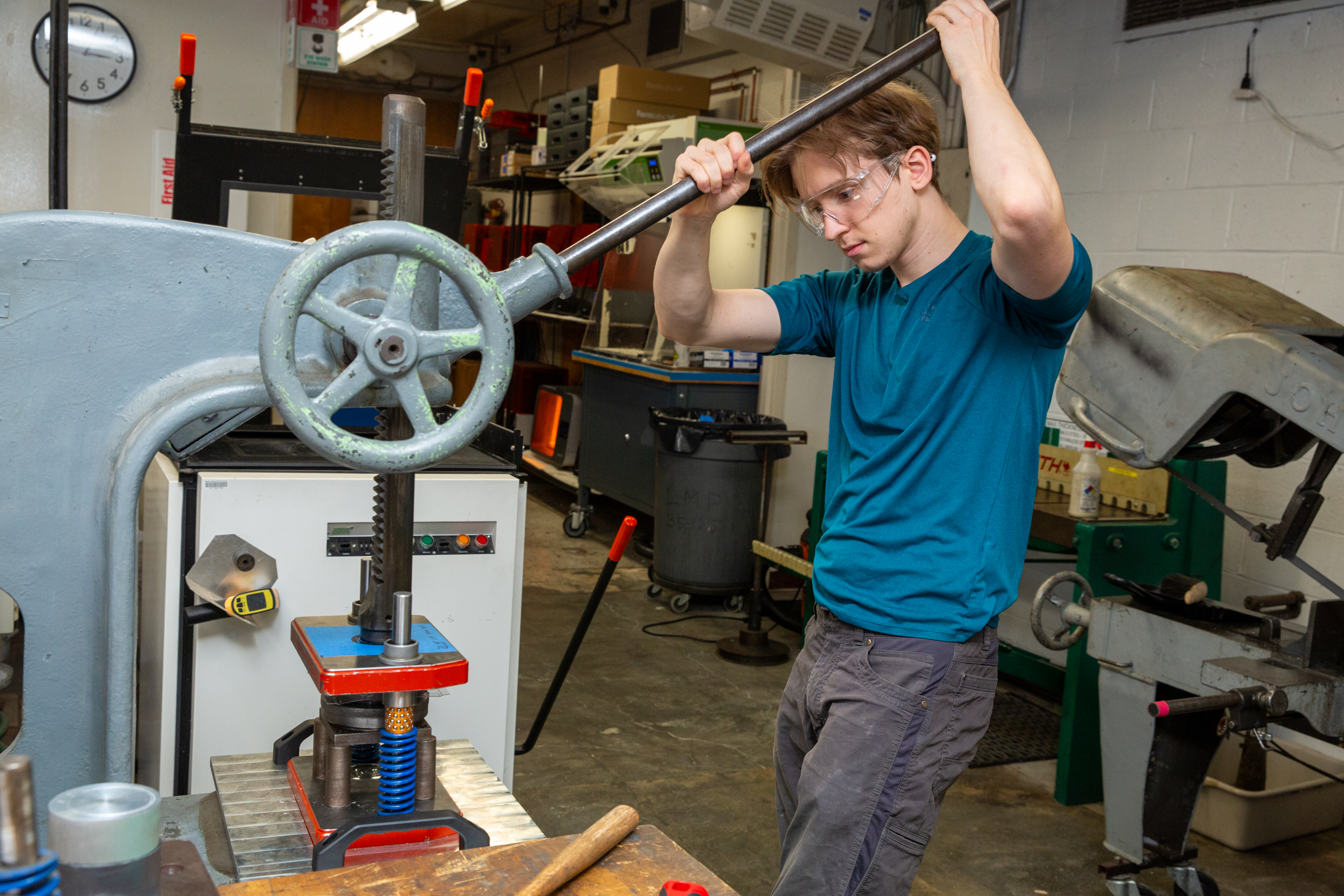 Amos Sataldi ’27 cuts the cover plate for his group’s Yo-Yos.